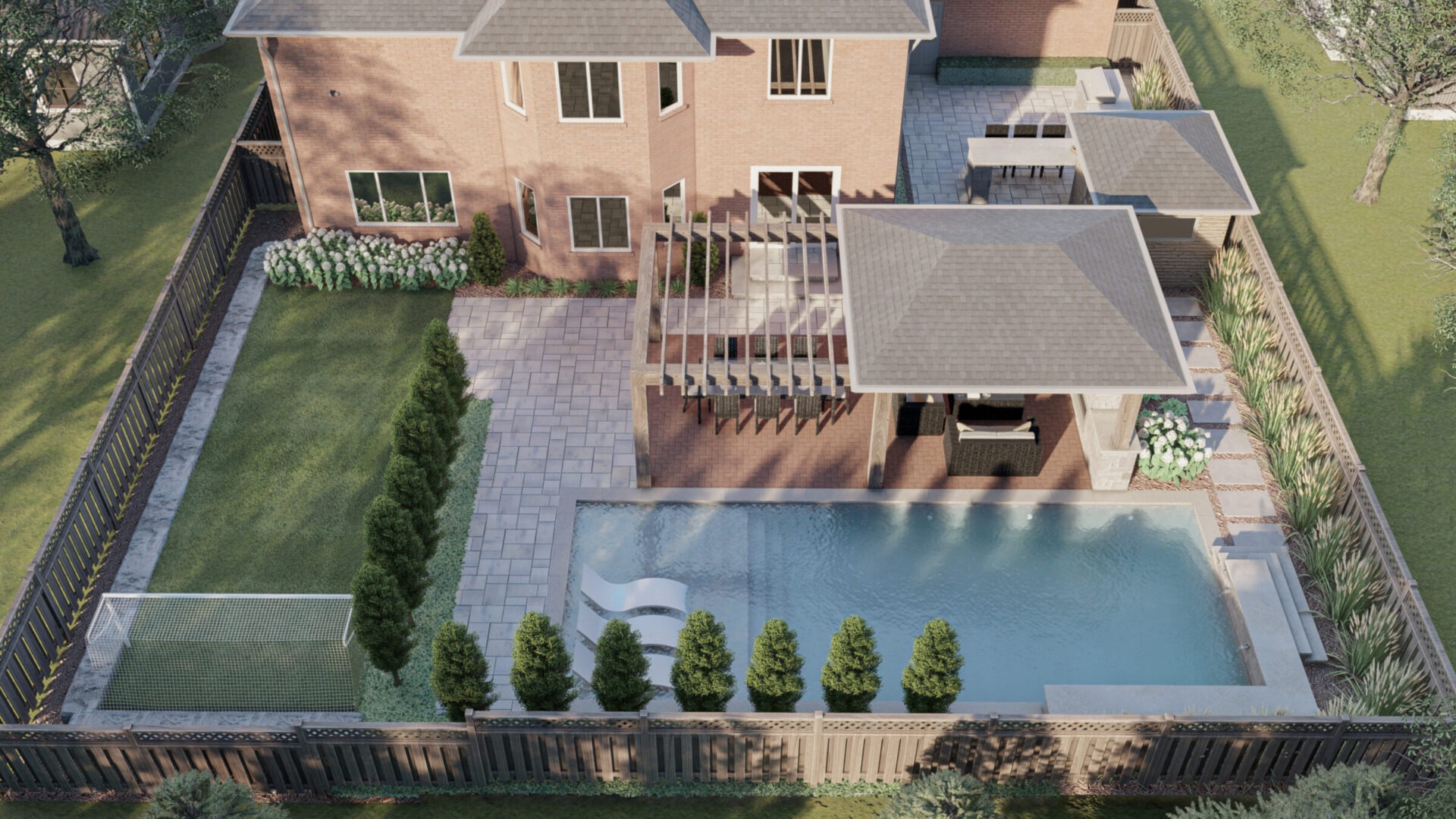 Aerial view of a backyard featuring a pool, patio, and pergola, surrounded by greenery and wooden fencing.