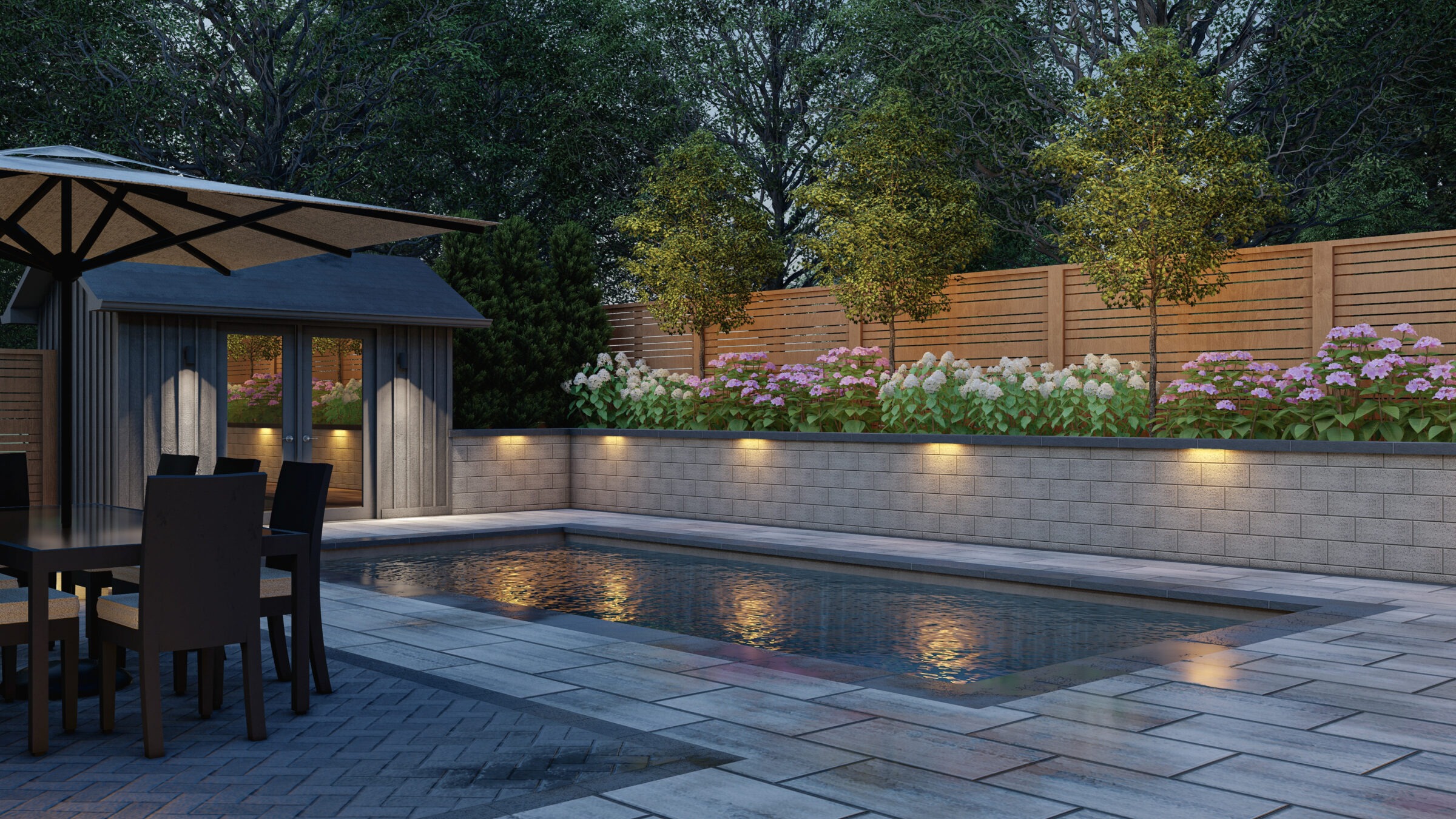 A backyard features a swimming pool, patio furniture, umbrella, small shed, and garden with illuminated flowers, surrounded by wooden fencing and lush trees.