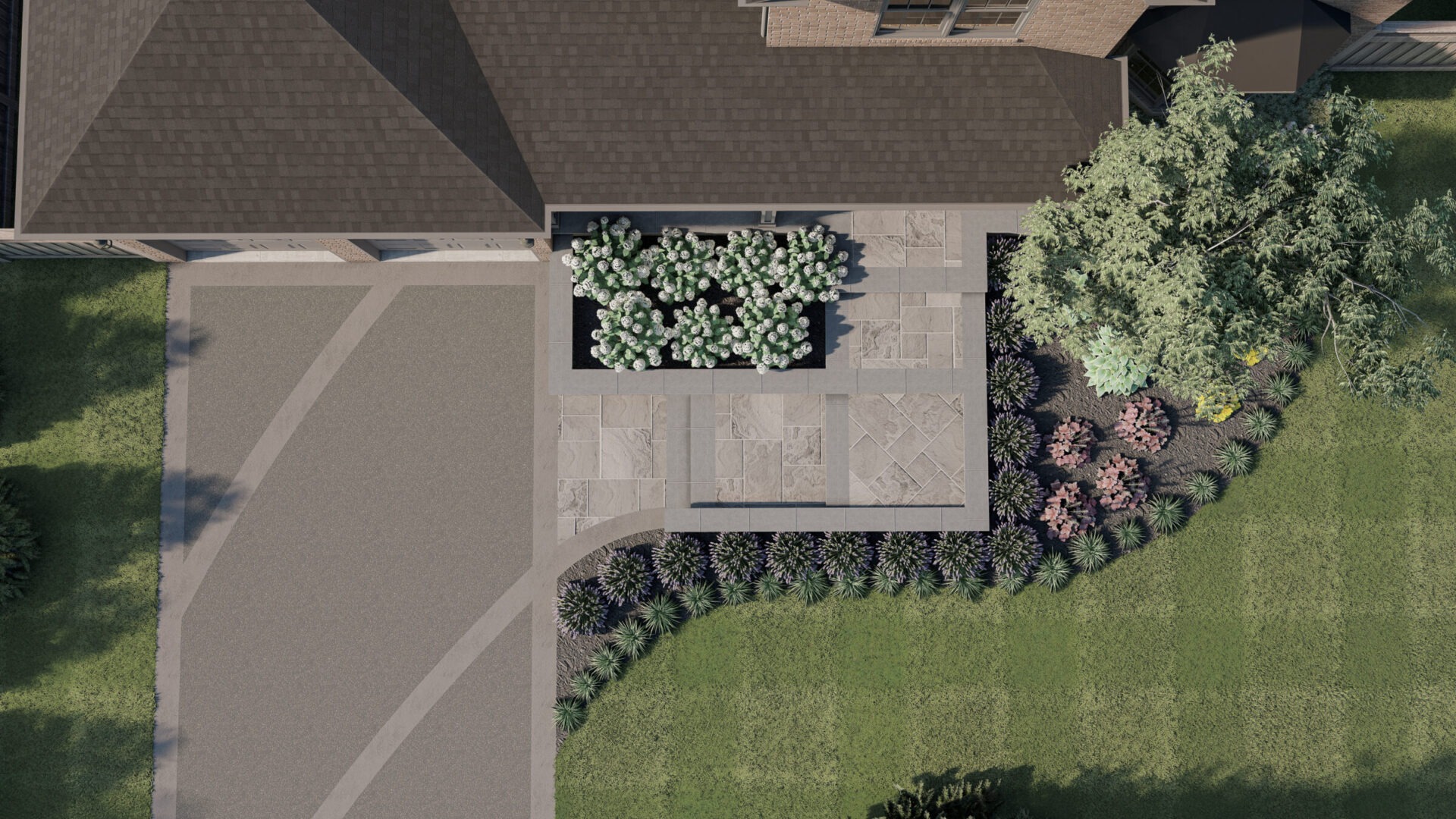 Aerial view of a landscaped garden with geometric pathways, surrounded by trees and flowers, adjacent to a building with a dark roof.