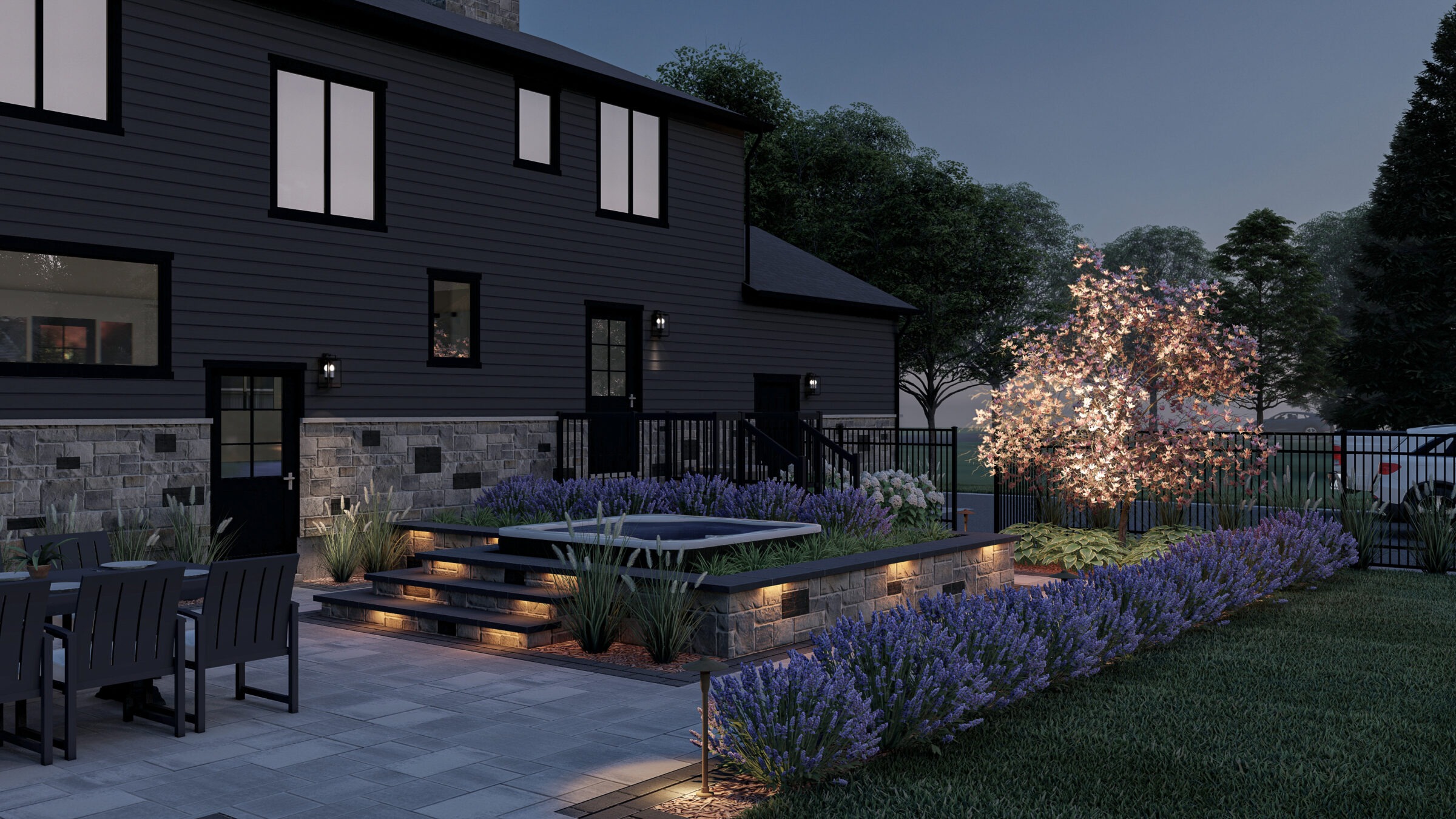 Modern patio with illuminated landscaping, steps, and seating area. Evening setting, surrounded by trees and enhanced with soft outdoor lighting.